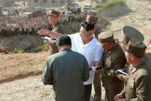 Undated photo North Korean leader Kim Jong-Un (C) visiting Rason City to inspect recovery work in the area hit by floods in Augu