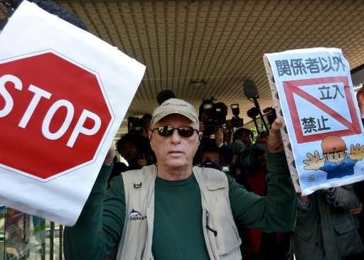 US dolphin activist Ric O'Barry, the central figure in the Oscar-winning documentary &quot;The Cove&quot;, protests against dolp