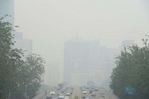 Vehicles on smog-blighted streets in Beijing on June 23, 2015