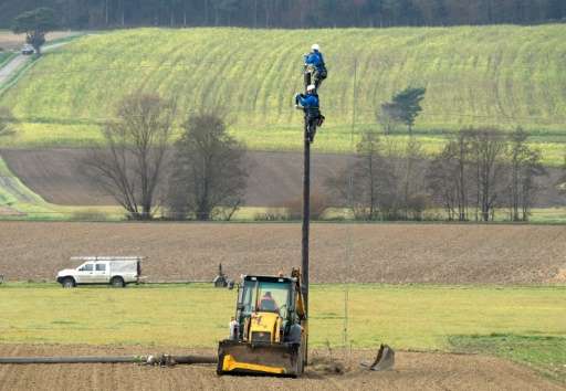 Workers service a local power line at the town of Guessing, where just 25 years ago was one of the poorest in Austria