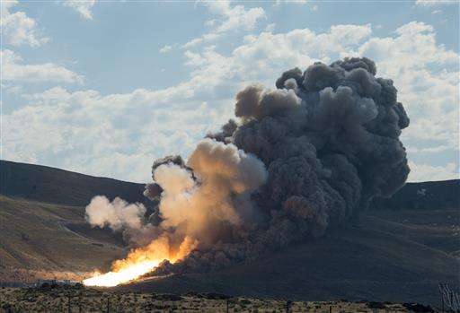 Booster rocket fires in key NASA test for Mars missions