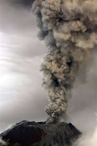 Ecuador volcano sends up towering cloud of ash