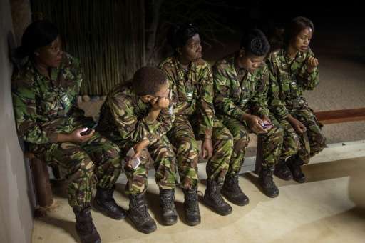 Female members of the anti-poaching team &quot;Black Mambas&quot; conduct a routine patrol through a wildlife reserve on Septemb