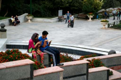 Iranians play Pokemon Go in northern Tehran's Mellat Park on August 3, 2016