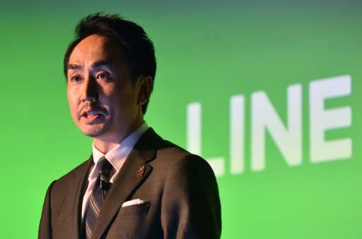 Line Corp. president and CEO, Takeshi Idezawa, speaks during a press conference following the company's stock exchange listing c