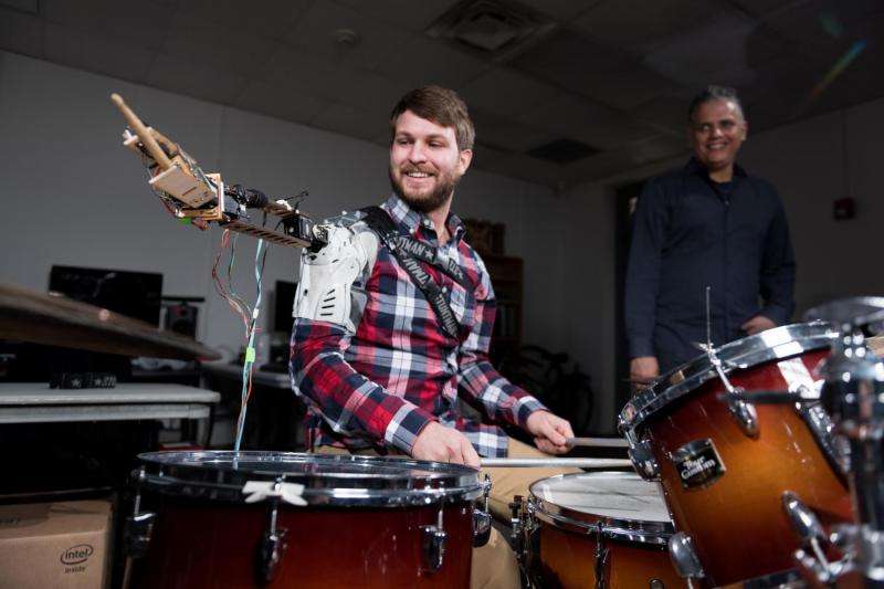 Wearable robot transforms musicians into 3-armed drummers
