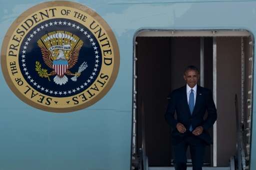 US President Barack Obama disembarks from Air Force One upon his arrival at Hangzhou Xiaoshan International Airport on September