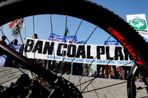 Environmentalists take part in a bicycle ride to show solidarity for the global movement for climate justice, in Manila, in Dece
