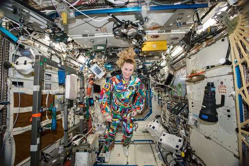 NASA astronaut wears spacesuit painted by kids with cancer