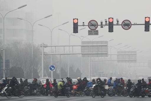 Smog chokes Chinese cities, grounding flights, closing roads
