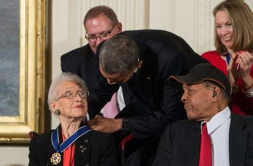 US President Barack Obama presents the Presidential Medal of Freedom to NASA mathematician and physicist Katherine Johnson at th