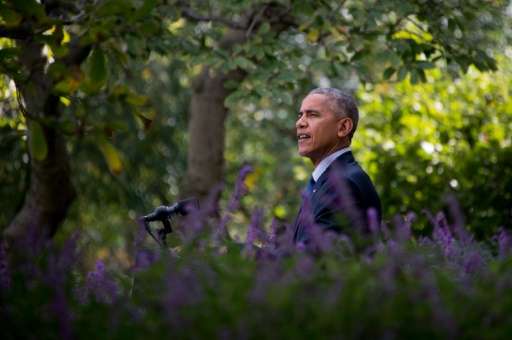 US President Barack Obama speaks about the Paris Agreement from the Rose Garden of the White House in Washington, DC, October 5,