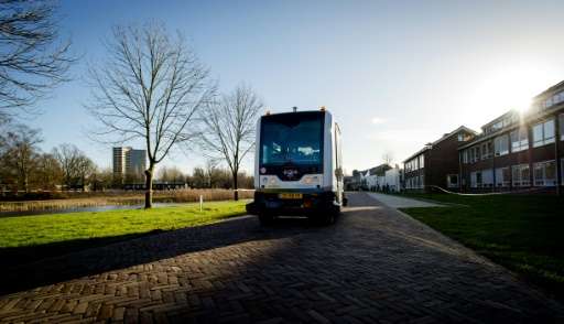 A picture taken in Wageningen, on January 28, 2016 shows the WEpod shuttle, designed to carry six people without a driver, runni