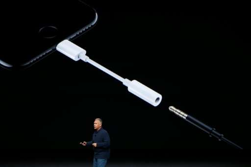 Apple Senior Vice President of Worldwide Marketing Phil Schiller introduces a Lightning to 3.5 mm audio jack adapter during a la