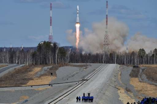 A Russian Soyuz 2.1a rocket, carrying Lomonosov, Aist-2D and SamSat-218 satellites, lifts off from the launch pad of the new Vos
