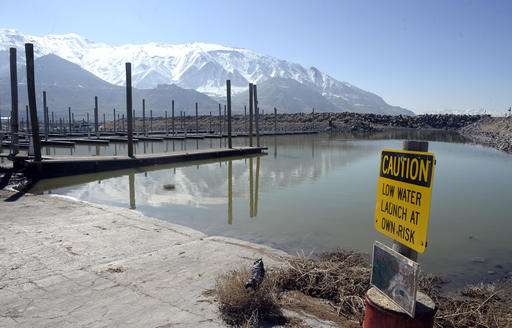 Beached boats, pink water as drought saps Great Salt Lake