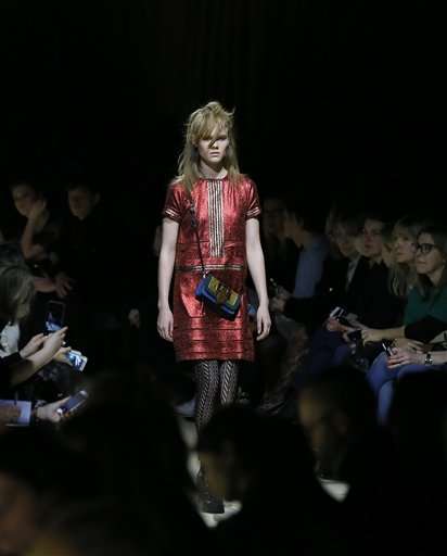 Luxury fashion world upending tradition to join digital age
