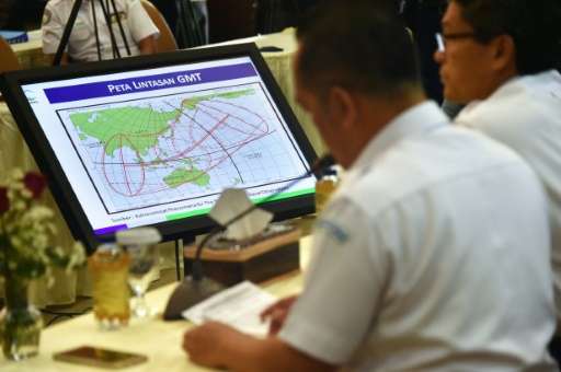 Officials display a map of the planned trajectory across the Indonesian archipelago of the upcoming total solar eclipse