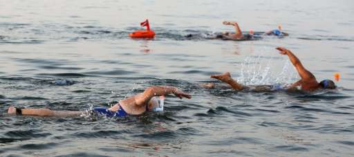 Participants take part in a 17-kilometre swim from Jordan to Israel across the Dead Sea, organised by the EcoPeace charity aimed