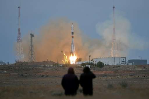 A Russian Soyuz MS-02 spacecraft carrying a crew to the International Space Station blasts off from the Russian-leased Baikonur 