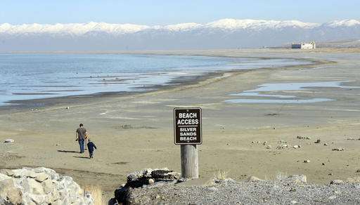 Beached boats, pink water as drought saps Great Salt Lake