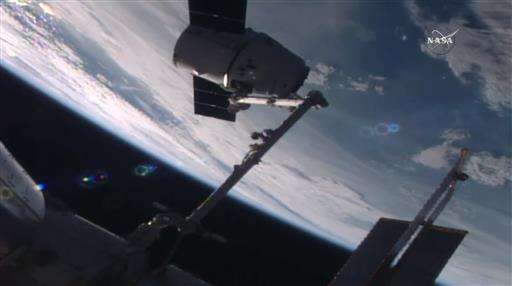 SpaceX Dragon capsule delivers new station docking port