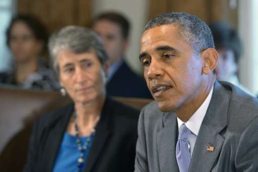 US President Barack Obama speaks during a cabinet meeting next to Secretary of the Interior Sally Jewell at the White House in J