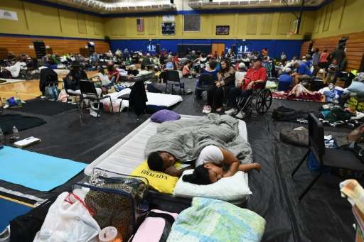 Local residents take shelter at the Pedro Menendez high school in St. Augustine, Florida, on October 6, 2016, ahead of Hurricane