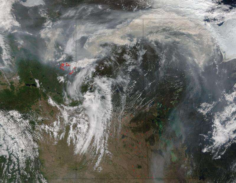NASA satellites image Fort McMurray fires day and night