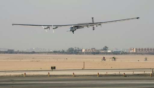Solar-powered Solar Impulse 2 aircraft lands at Cairo International Airport on July 13, 2016, for the penultimate stage of its w
