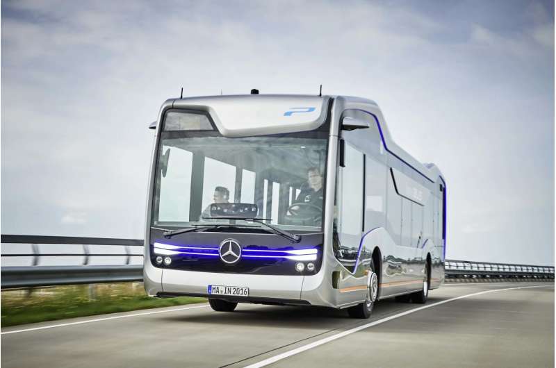 Smiling, hands-free driver sets comfort mood in Mercedes-Benz Future Bus