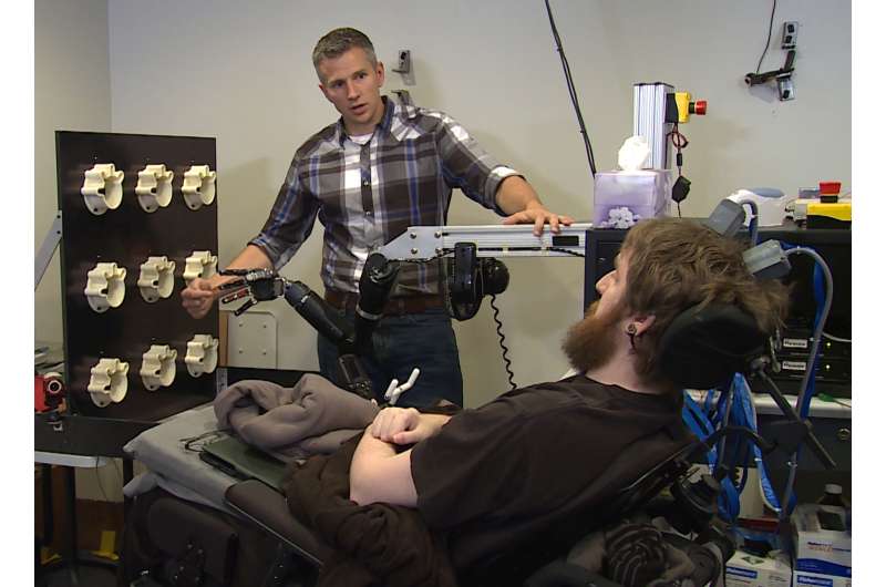 In a first, brain computer interface helps paralyzed man feel again