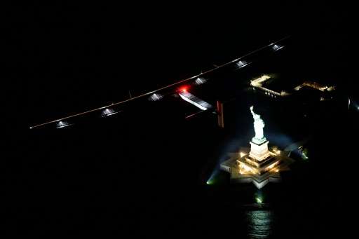 Solar Impulse 2 flies past the Statue of Liberty as it approaches New York City on the latest leg of a record-breaking, round-th