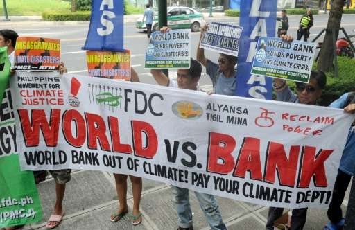 Members of the Freedom from Debt Coalition lead a protest in front of the World Bank office in Bonifacio Global City in suburban