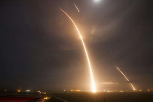 A 9-minute time exposure shows the launch, re-entry, and landing burns of the SpaceX  Falcon 9 rocket