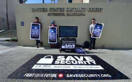 Activists gather in front of the US District Court in Riverside, California, on March 22, 2016, where the Apple v FBI trial was 