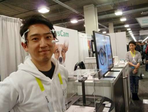 Alex Chang of Looxid Labs demonstrates a brainwave headset at the Consumer Electronics Show on January 7, 2016 in Las Vegas, Nev