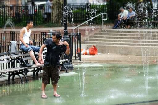 A man cools off at a water fountain in New York in 2015, where the month of May was recorded as the hottest in modern history ac