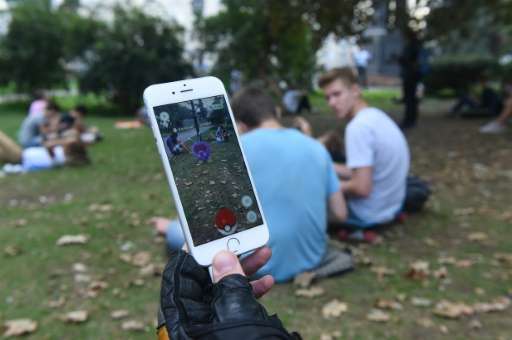 A man plays at the Pokemon GO augmented reality game in central Moscow on August 23, 2016