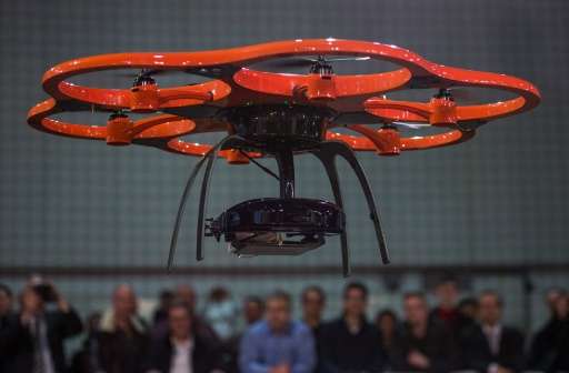 An Aibot X-6 drone built by German multicopters company Aibotix hovers during a demonstration at the Digital Business fair CEBIT