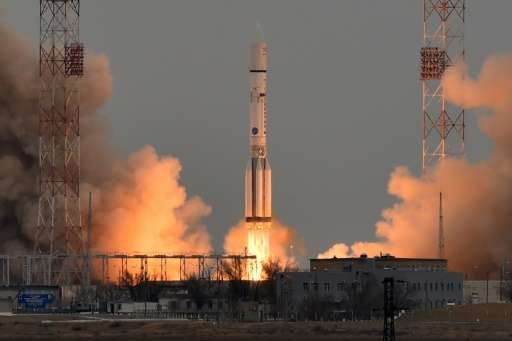 A Russian Proton-M rocket carrying the ExoMars 2016 spacecraft blasts off from the launch pad at the Russian-leased Baikonur cos