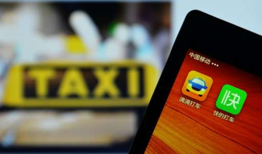 A smartphone shows the Didi Dacheb app which commands over 83 percent market share of China's domestic market for booking taxis 