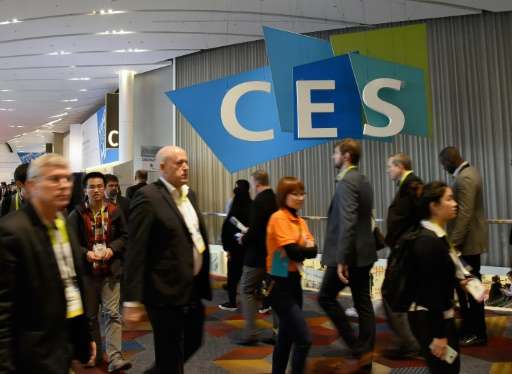 Attendees walk past a CES logo at CES 2016 at the Sands Expo and Convention Center on January 6, 2016 in Las Vegas, Nevada