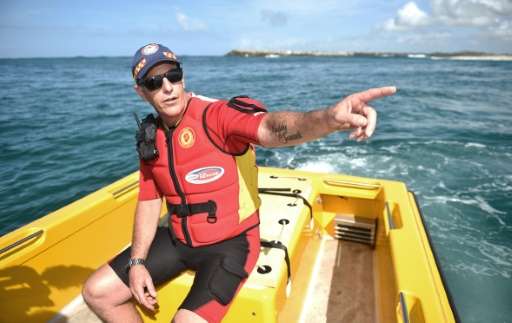 Australian lifesaver Garry Meredith on shark patrol in a custom-made rescue boat off the coast of Ballina, in April 2016