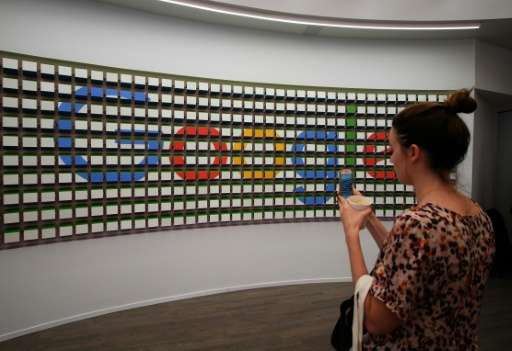 A wall in Google's new shop is decorated with an artful arrangement of blue, red, yellow and green blocks, arranged to display t