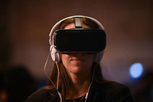 A Websummit attendee tries a virtual reality goggles during the Web Summit at Parque das Nacoes, in Lisbon on November 10, 2016