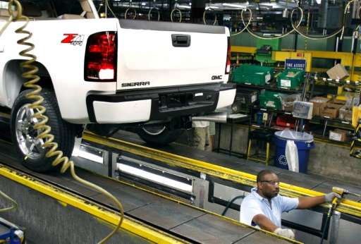 A worker assembles General Motors trucks at the GM Flint Assembly Plant July 18, 2011 in Flint, Michigan
