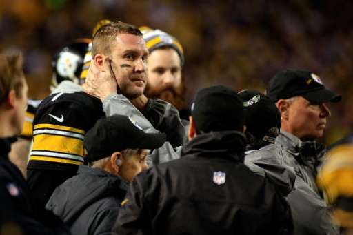 Ben Roethlisberger of the Pittsburgh Steelers is tested for a concussion on the sideline at Heinz Field