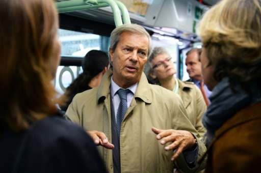 Chairman and CEO of French industrial group Bollore Group, Vincent Bollore, rides on a bus in Paris, in May 2016