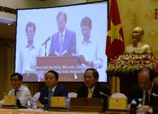 Chen Yuan Cheng, chairman of Formosa Ha Tinh Steel Corp, delivers an apology via a video message projected during a press confer